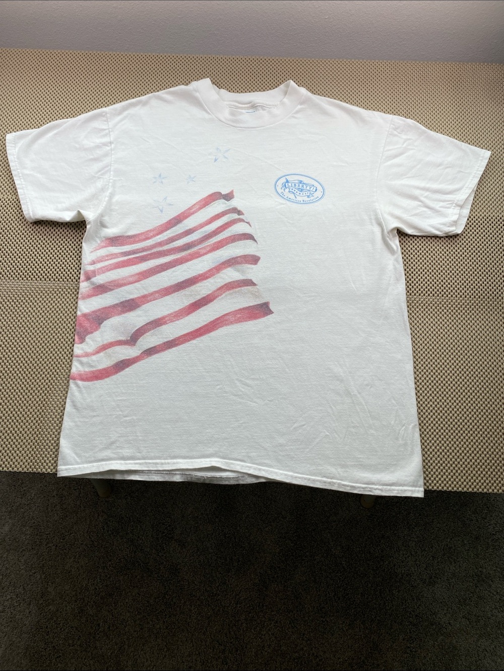 White Short-Sleeve Tee with Red Flag Graphic Double Sided and Blue Chest Emblem